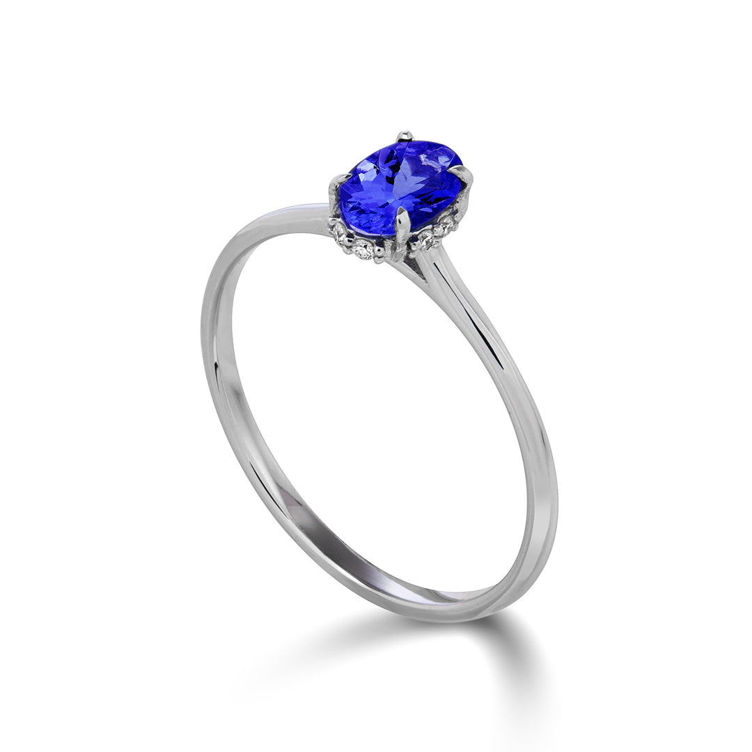 Nihama an 18k tanzanite oval 6x4 set with diamonds NA5219O4TZN